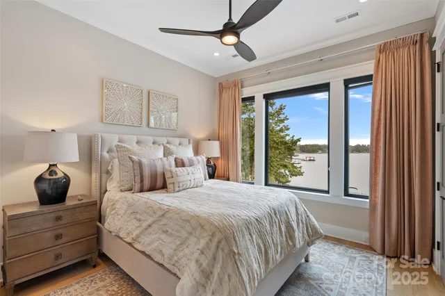 a bedroom with a large bed and a window