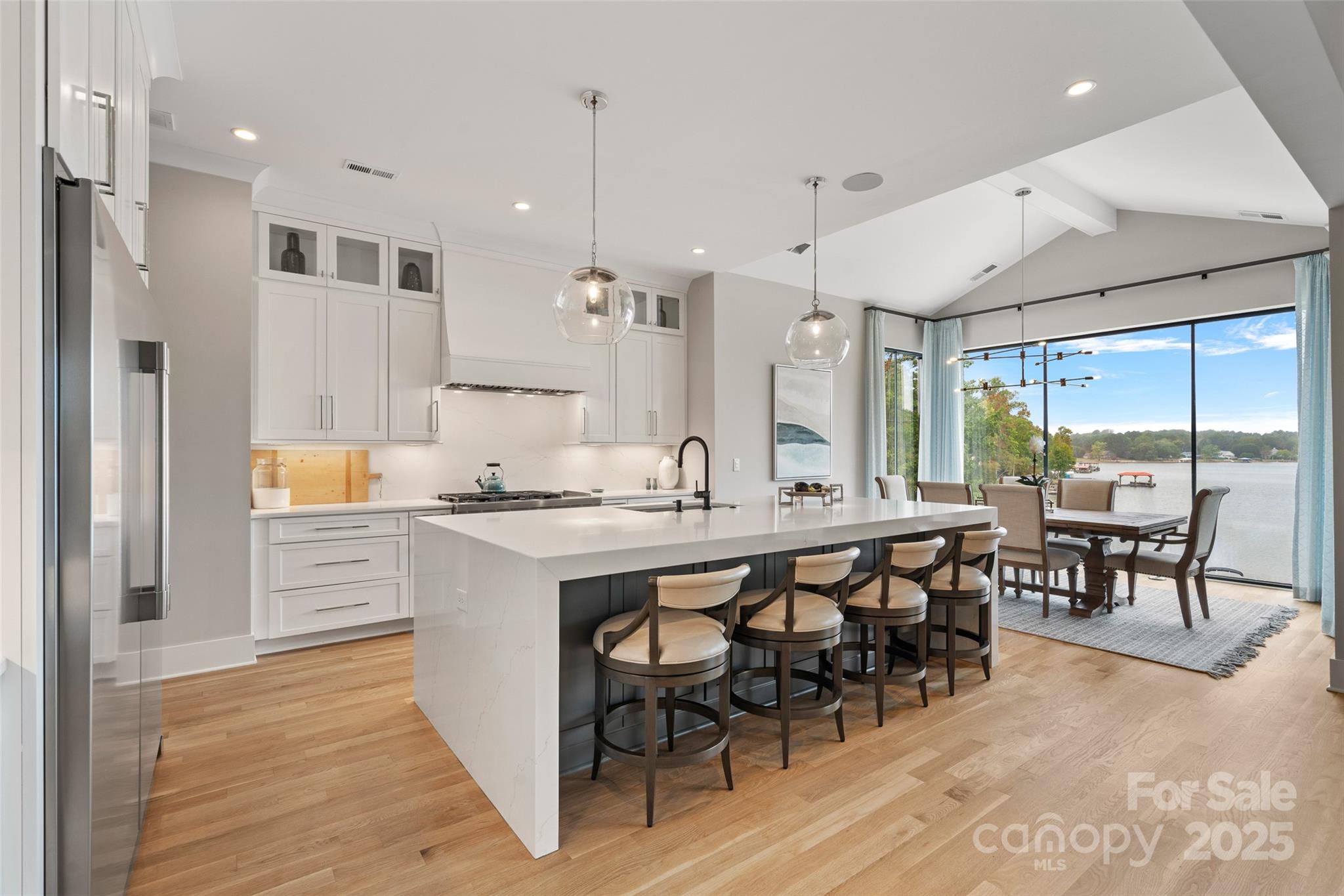 505 Kemp Road Mooresville, NC 28117 - Photo 2 of 38 a large kitchen with a table and chairs