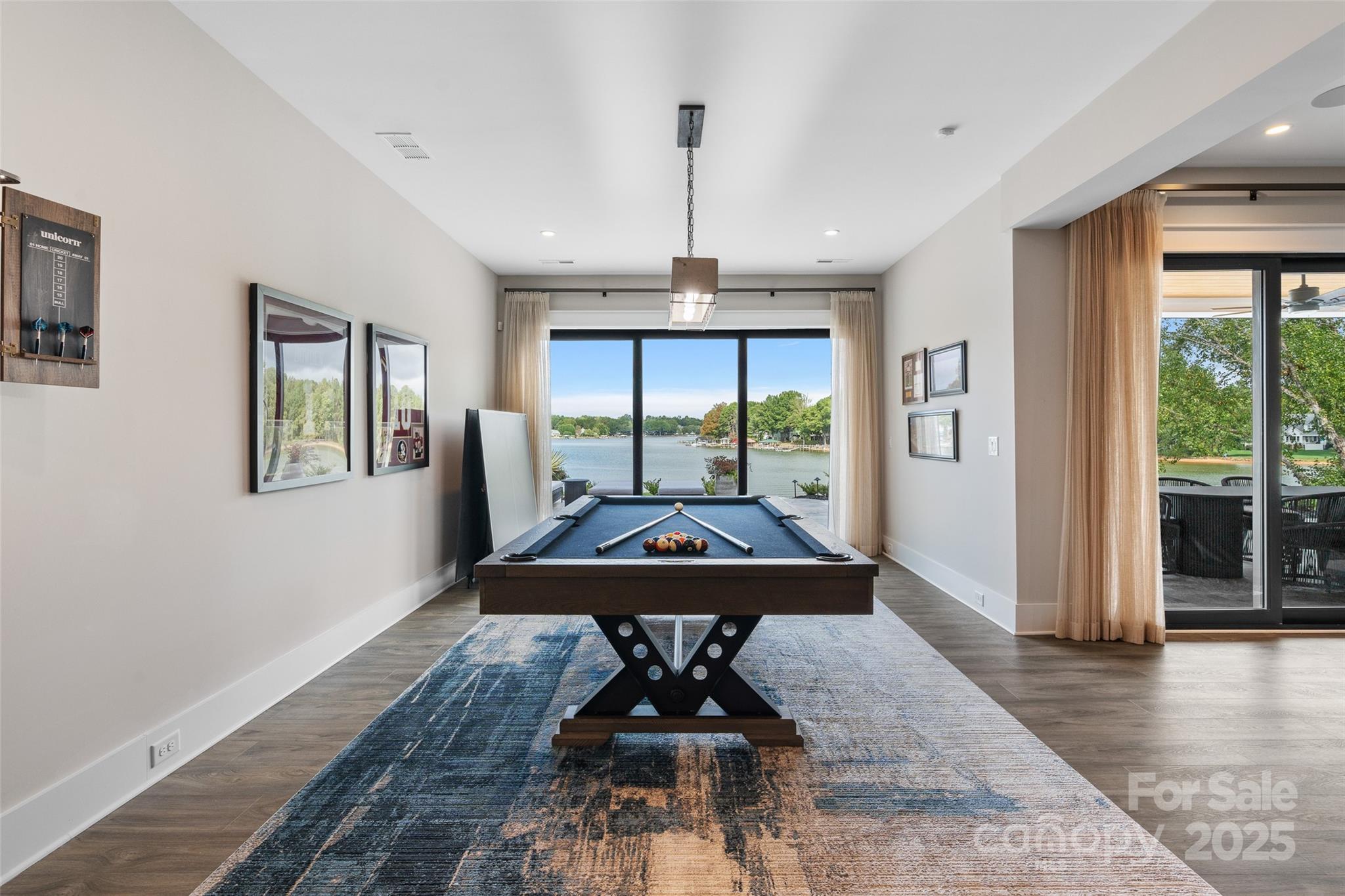 505 Kemp Road Mooresville, NC 28117 - Photo 24 of 38 a dining room with wooden floor a chandelier
