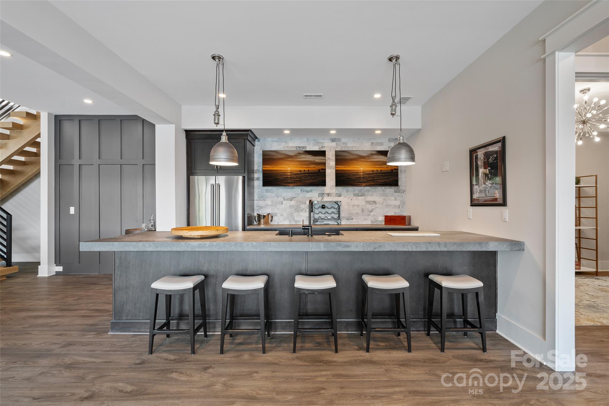 505 Kemp Road Mooresville, NC 28117 - Photo 25 of 38 a kitchen with a dining table chairs cabinets and stainless steel appliances