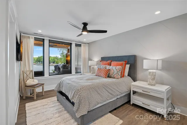 a bedroom with a large bed and a large window