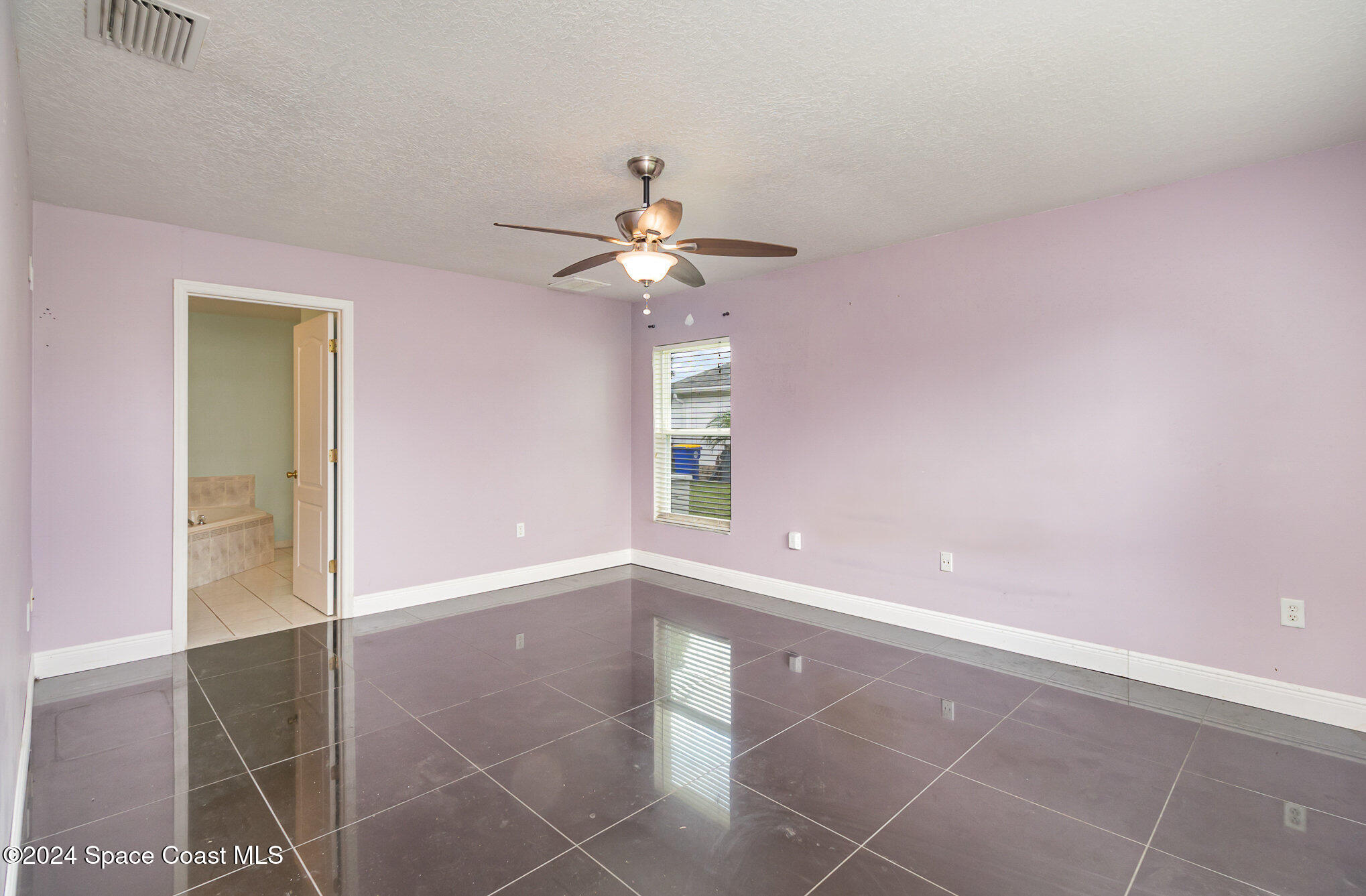 1223 Winding Meadows Road Rockledge, FL 32955 - Photo 15 of 27 a view of an empty room with a window