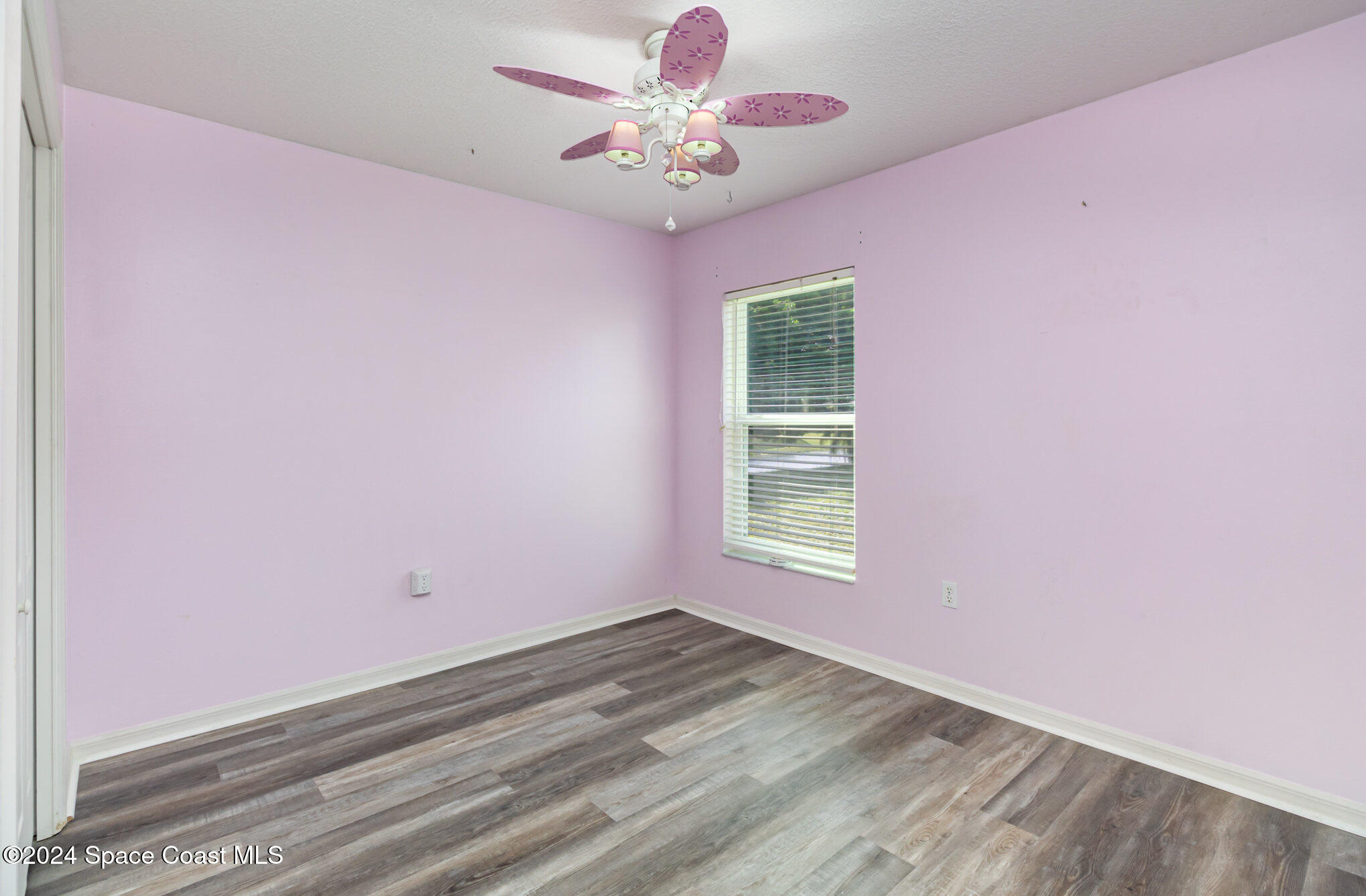 1223 Winding Meadows Road Rockledge, FL 32955 - Photo 19 of 27 an empty room with a window and a fan