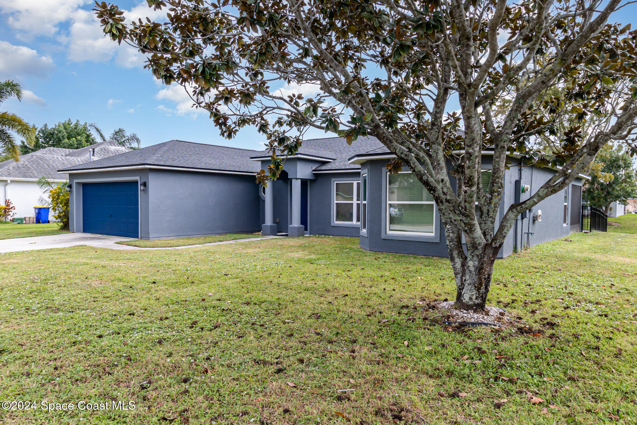 1223 Winding Meadows Road Rockledge, FL 32955 - Photo 2 of 27 a front view of a house with yard