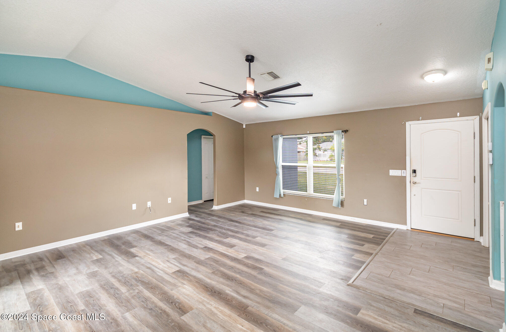 1223 Winding Meadows Road Rockledge, FL 32955 - Photo 7 of 27 a view of an empty room with a window