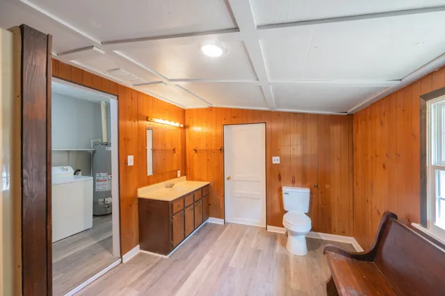 a view of a bathroom with tub and shower