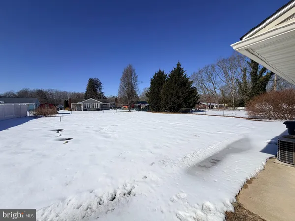 a view of swimming pool with a yard