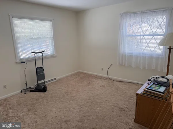 a room with water heater and a wooden door