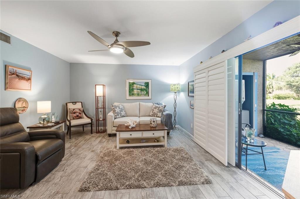 7380 St Ives Way, Unit 1108 Naples, FL 34104 - Photo 2 of 46 LIVING ROOM AND LANAI