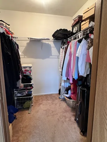a view of a livingroom with furniture and washer