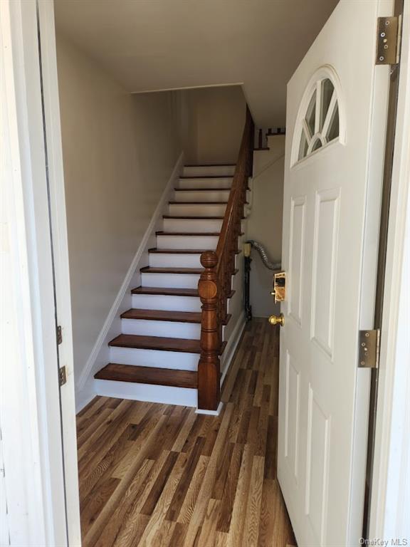 69 Saddle River Road, Unit #1 Monsey, NY 10952 - Photo 5 of 7 Stairs with wood-type flooring