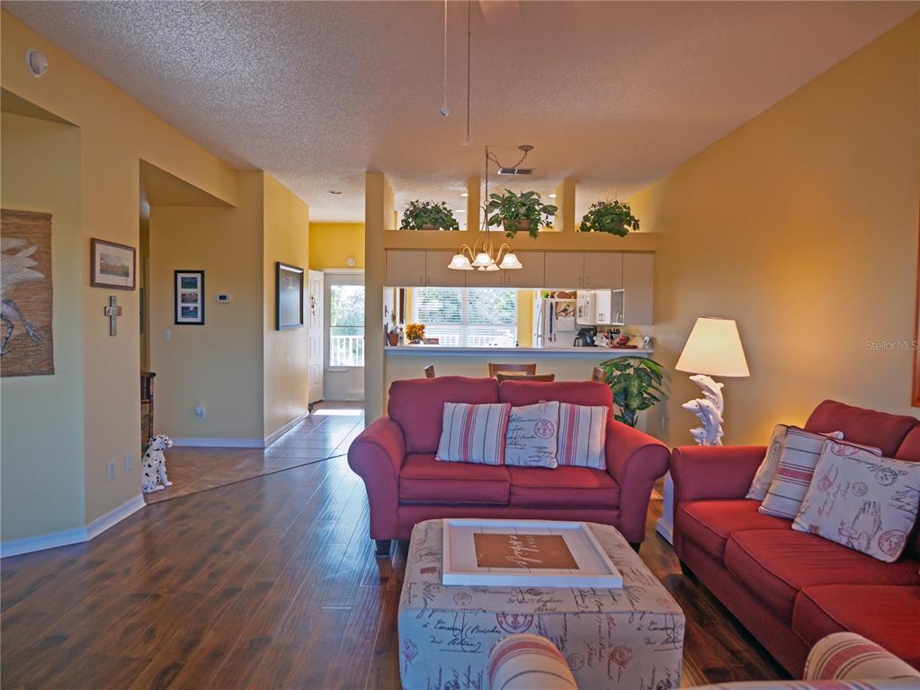 6401 99th Way North, Unit 15C St. Petersburg, FL 33708 - Photo 11 of 48 a living room with furniture