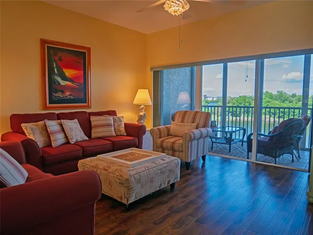 a living room with furniture and a large window