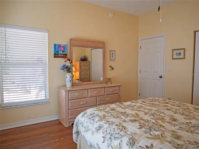 a bedroom with a bed and a dresser