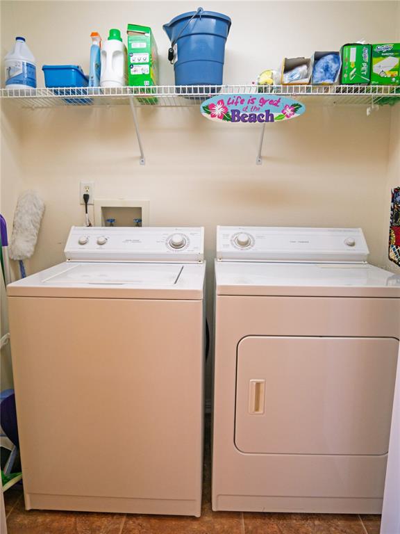 6401 99th Way North, Unit 15C St. Petersburg, FL 33708 - Photo 30 of 48 a utility room with dryer and washer