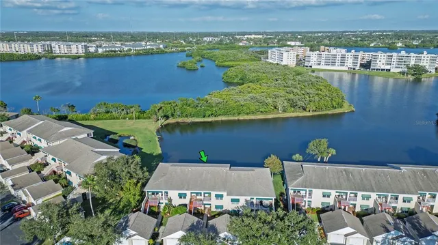an aerial view of a house with a lake view