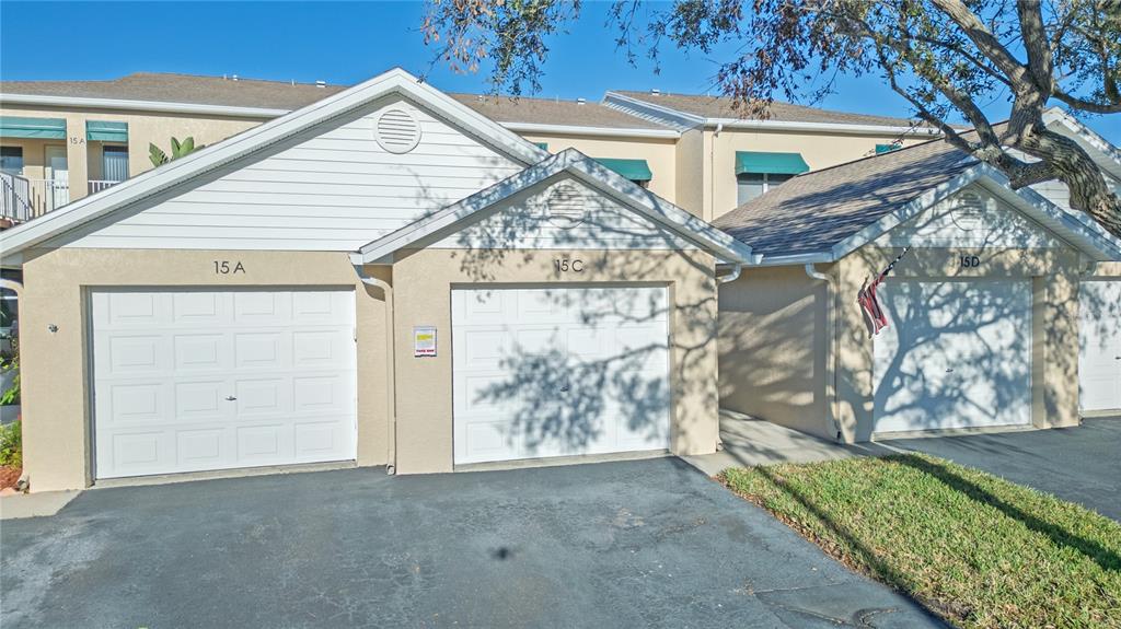 6401 99th Way North, Unit 15C St. Petersburg, FL 33708 - Photo 33 of 48 a view of a house with a street