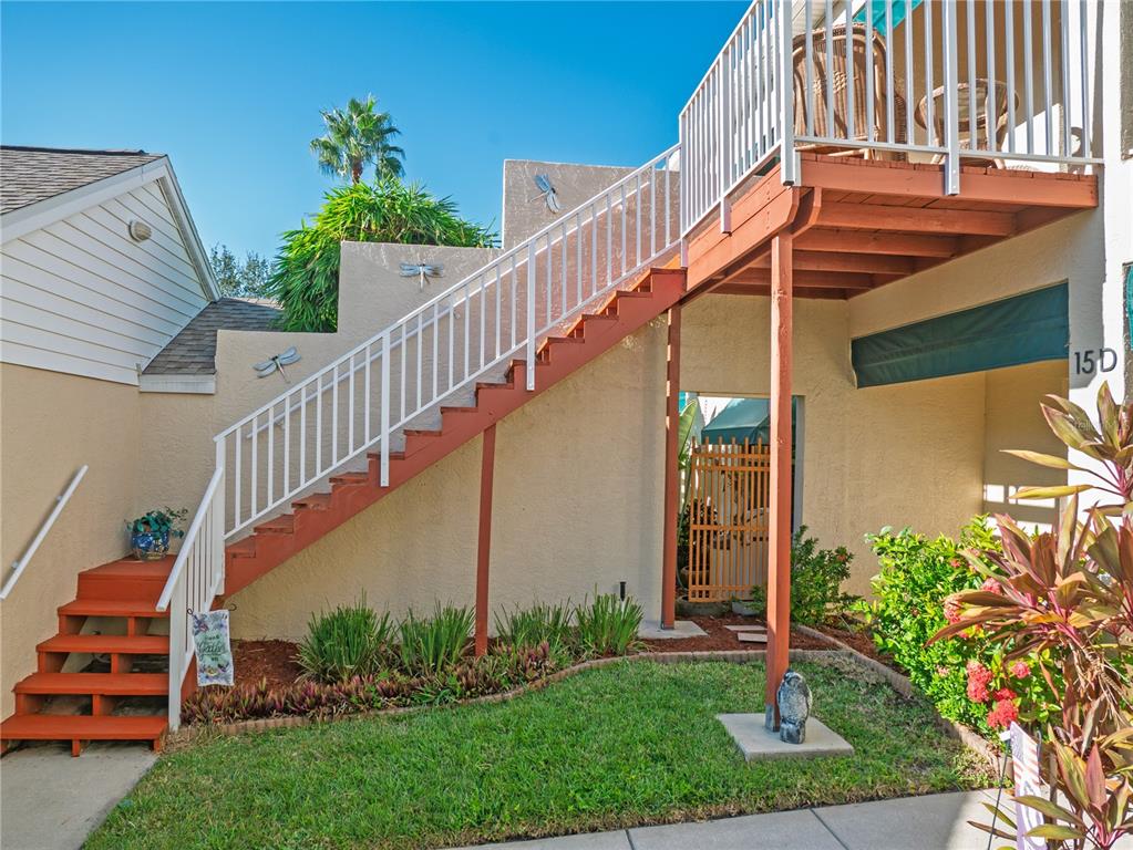 6401 99th Way North, Unit 15C St. Petersburg, FL 33708 - Photo 38 of 48 a balcony view with a flower garden