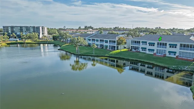 a view of a lake with a city skyline in the background