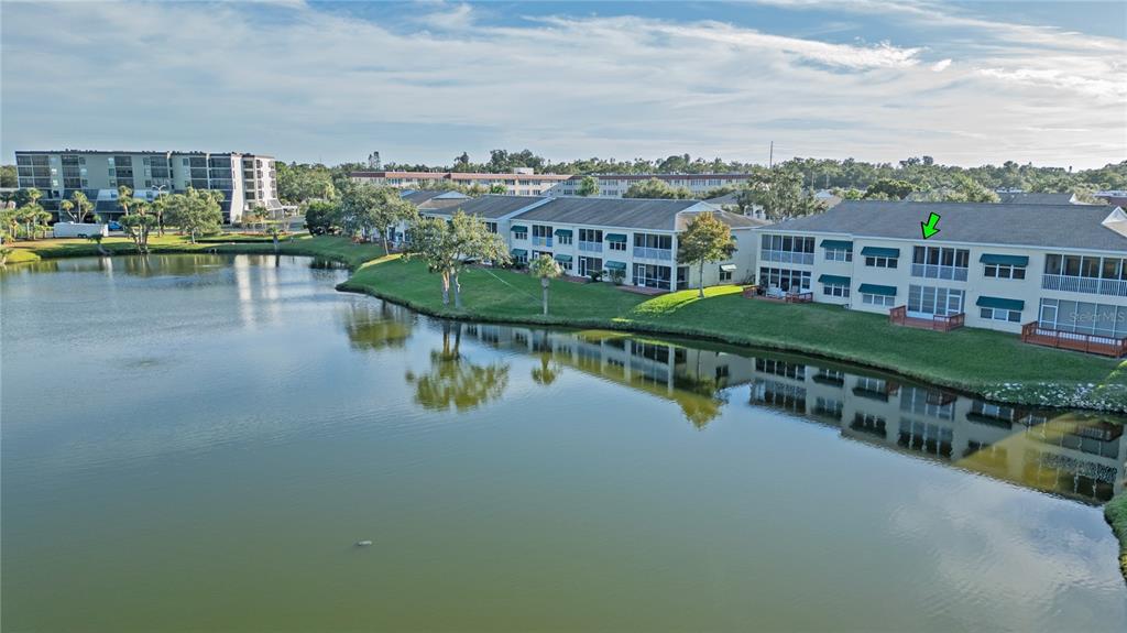 6401 99th Way North, Unit 15C St. Petersburg, FL 33708 - Photo 40 of 48 a view of a lake with a city skyline in the background