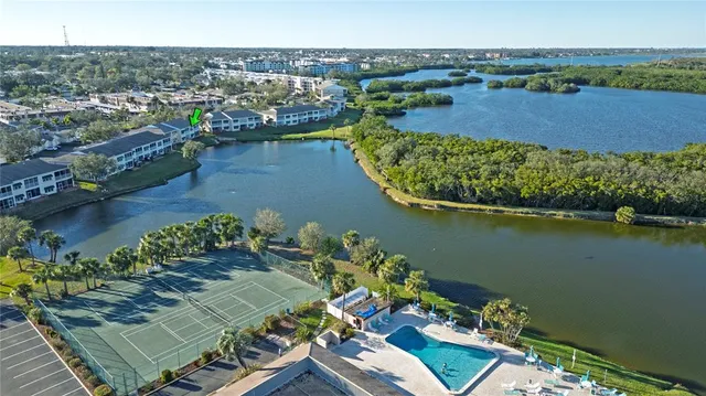 an aerial view of a house with a lake view
