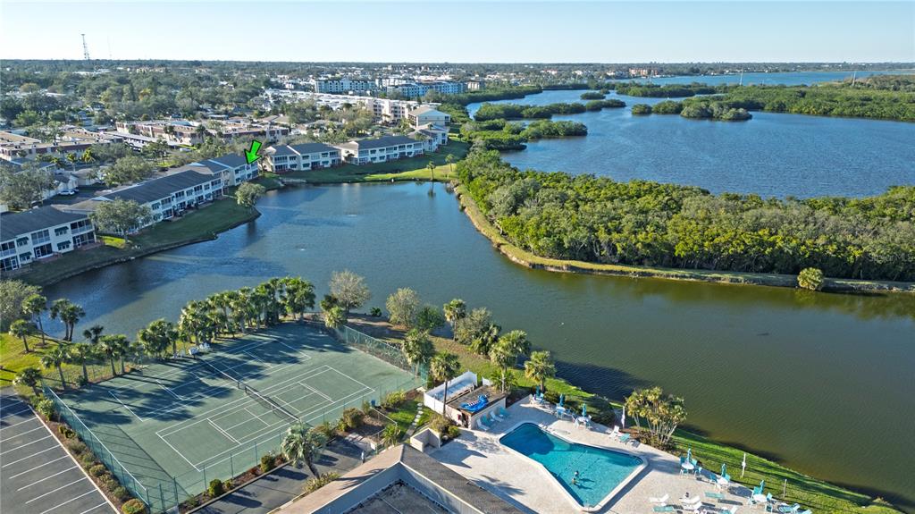 6401 99th Way North, Unit 15C St. Petersburg, FL 33708 - Photo 45 of 48 an aerial view of a house with a lake view