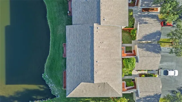 an aerial view of a house with a garden and plants