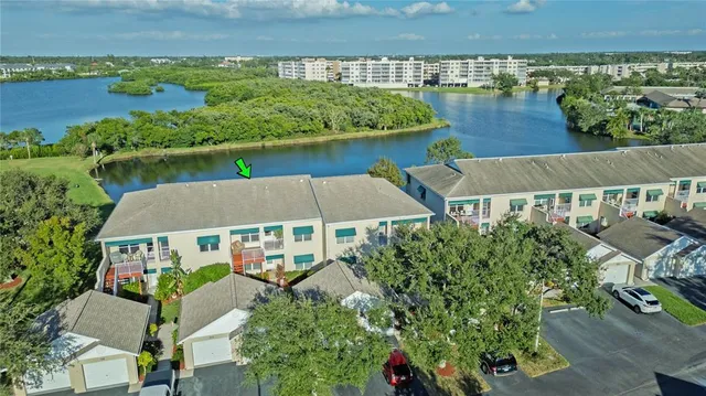 an aerial view of a house with garden space and outdoor seating