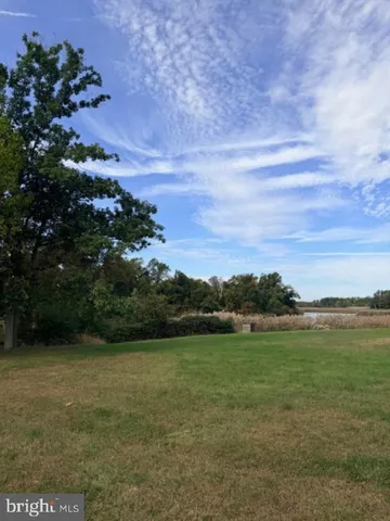 a view of a field with an outdoor space