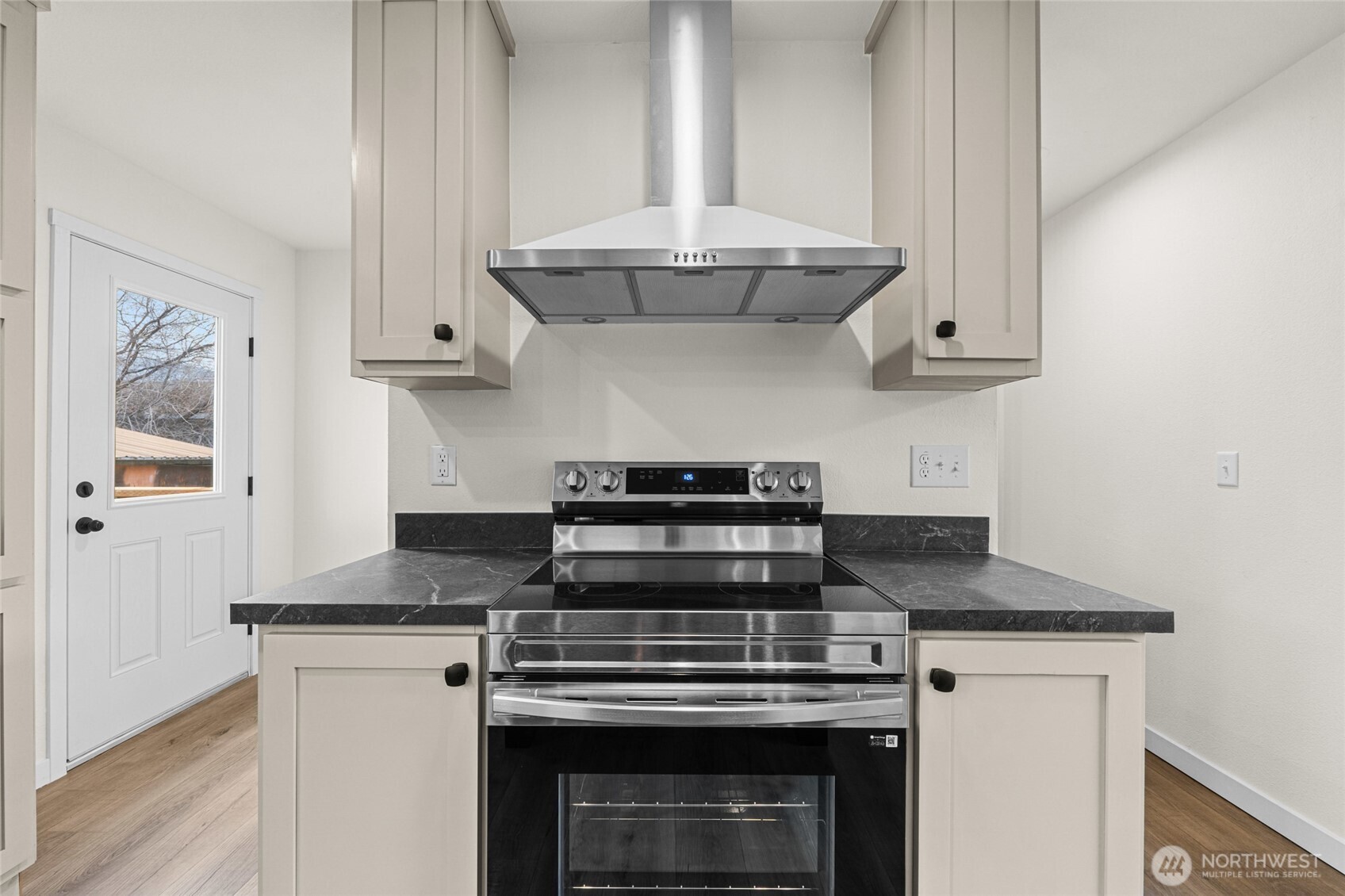 793 North Carter Street Colville, WA 99114 - Photo 4 of 19 a stove top oven sitting inside of a kitchen