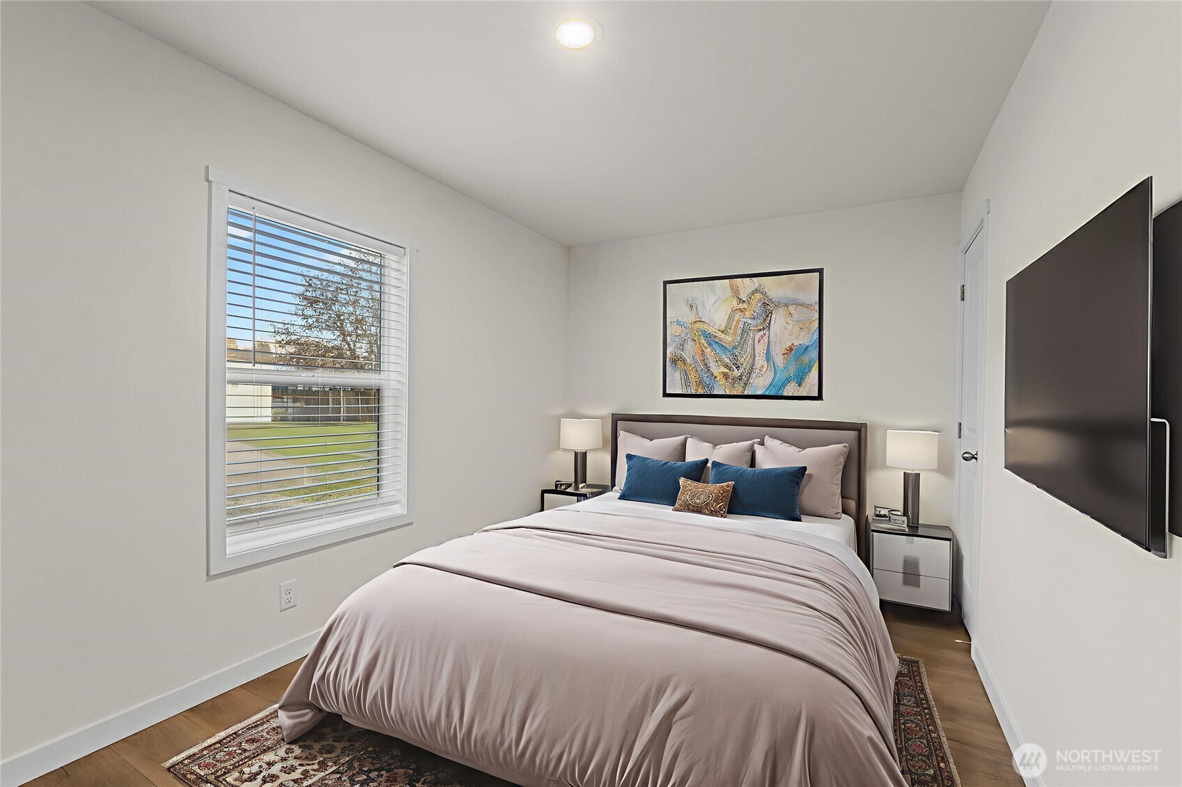 793 North Carter Street Colville, WA 99114 - Photo 7 of 19 a bedroom with a bed and a flat screen tv