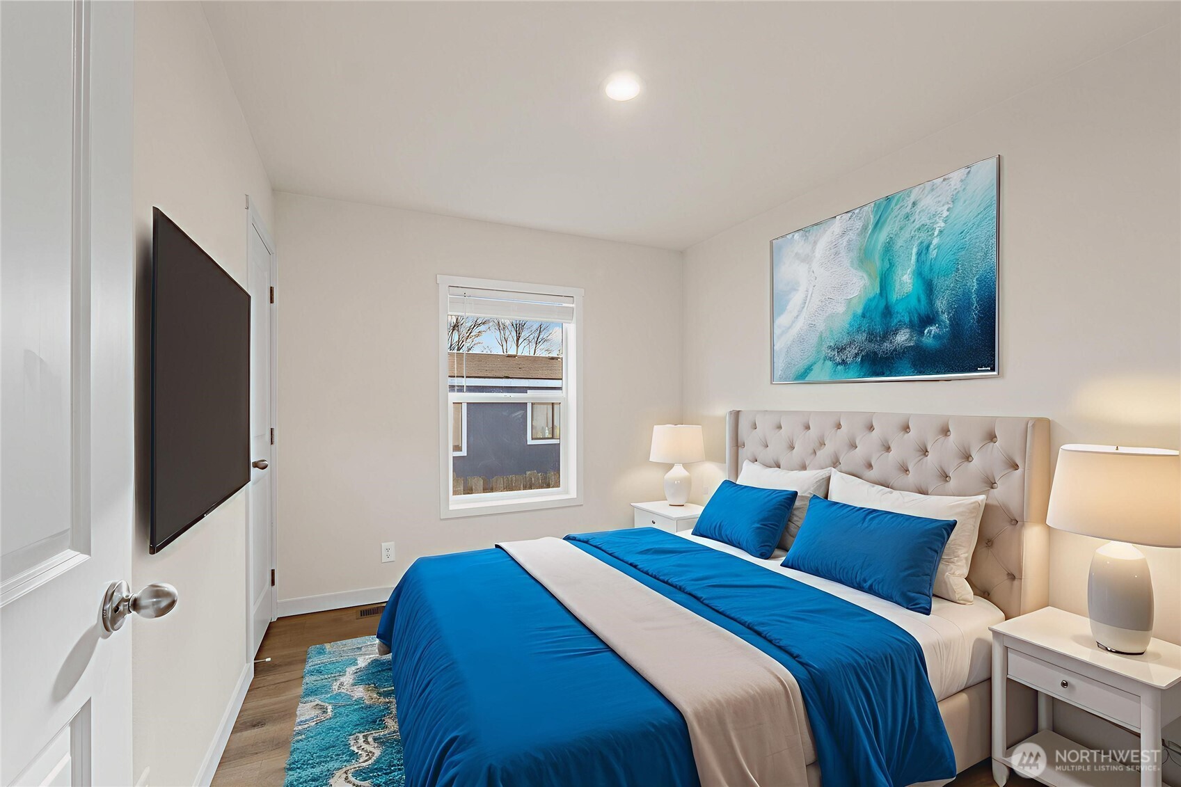 793 North Carter Street Colville, WA 99114 - Photo 8 of 19 a bedroom with a bed and glass window