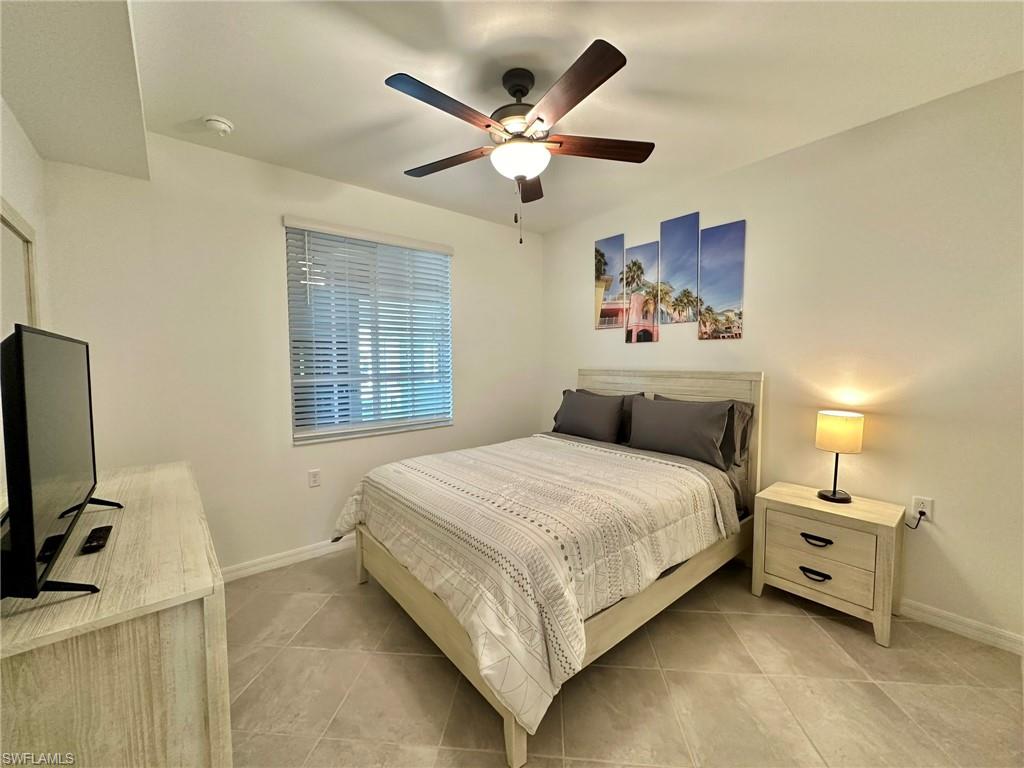 43985 Boardwalk Loop, Unit 2115 Babcock Ranch, FL 33982 - Photo 16 of 42 a bedroom with bed and window