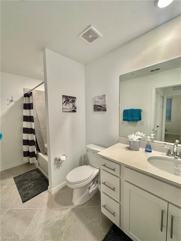 43985 Boardwalk Loop, Unit 2115 Babcock Ranch, FL 33982 - Photo 19 of 42 a spacious bathroom with a double vanity sink toilet and shower