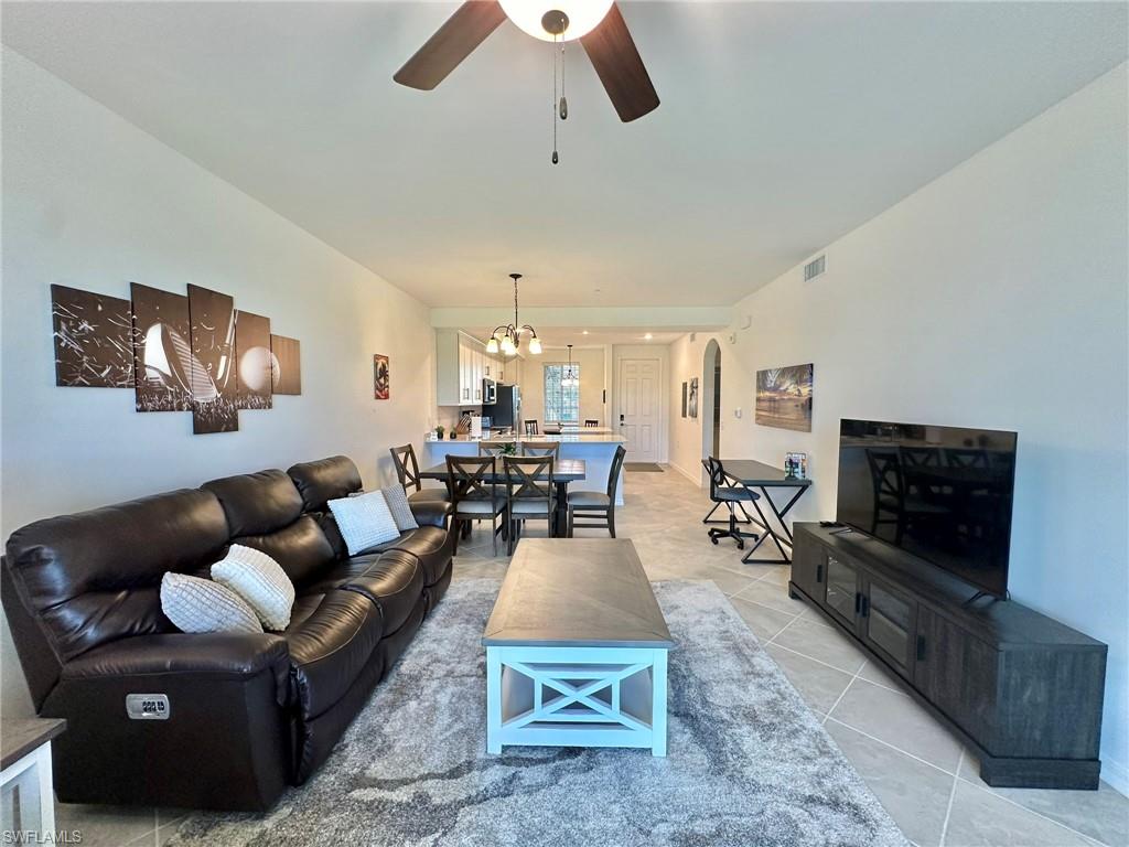 43985 Boardwalk Loop, Unit 2115 Babcock Ranch, FL 33982 - Photo 3 of 42 a living room with furniture and a flat screen tv