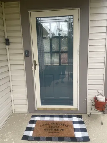 a view of empty room with window and fireplace