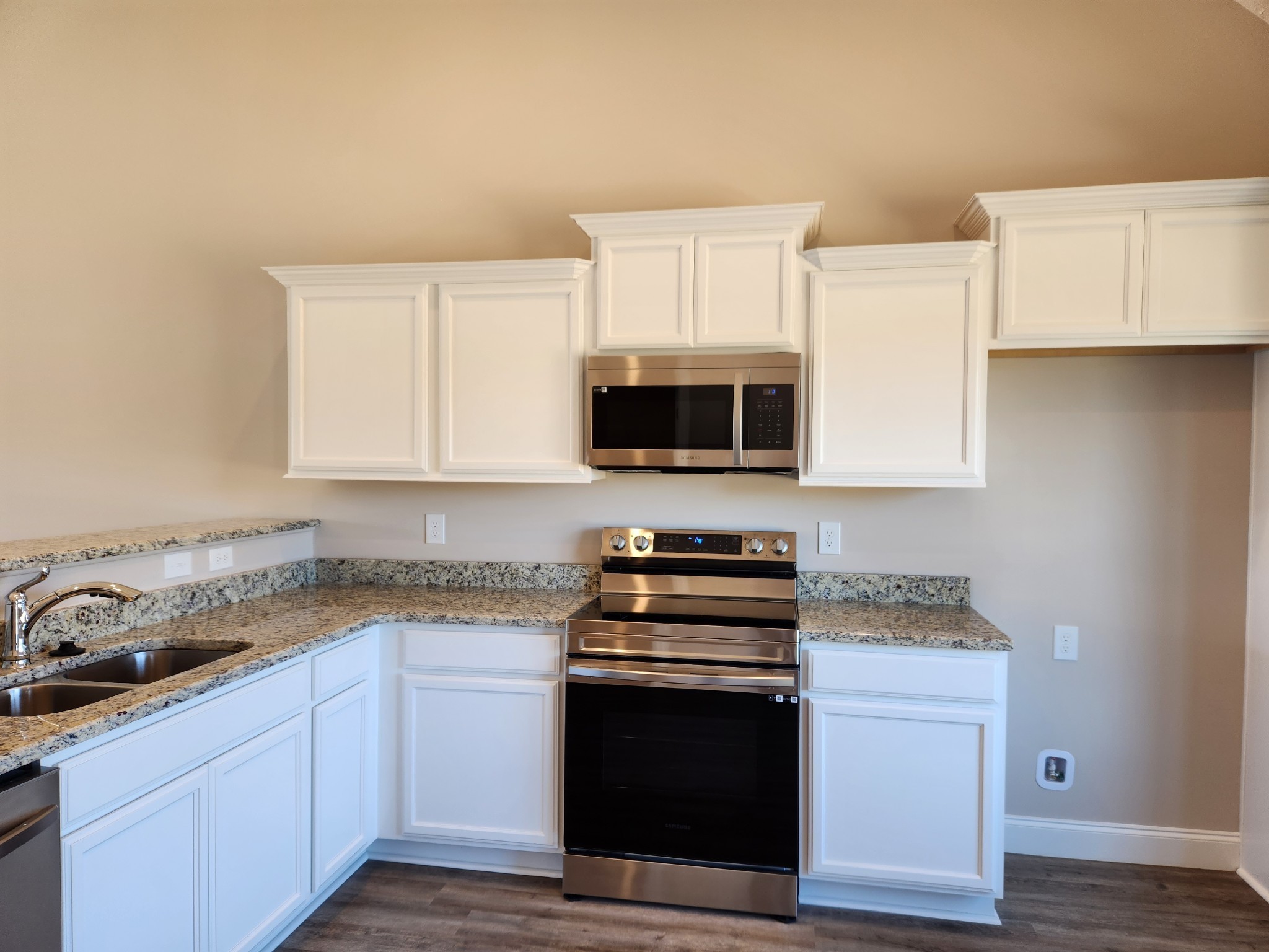 2831 Upstream Road Christiana, TN 37037 - Photo 7 of 60 a kitchen with granite countertop white cabinets and stainless steel appliances
