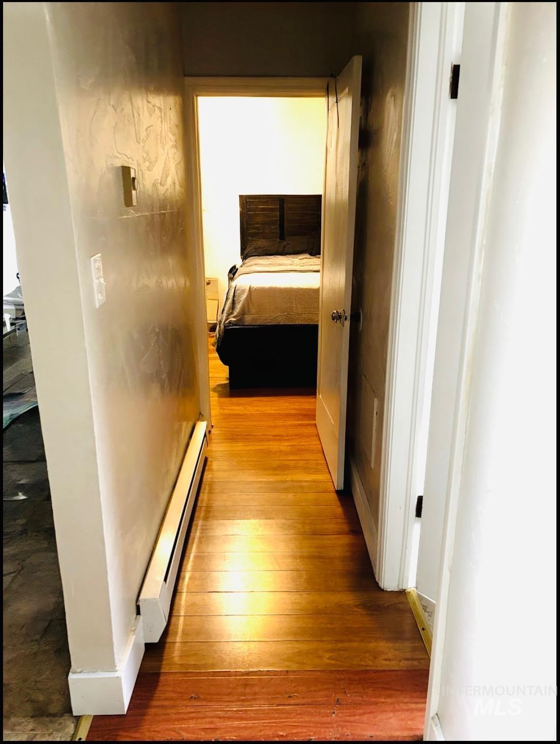 409 North 7th Street Payette, ID 83661 - Photo 12 of 23 Hardwood flooring throughout the hallway