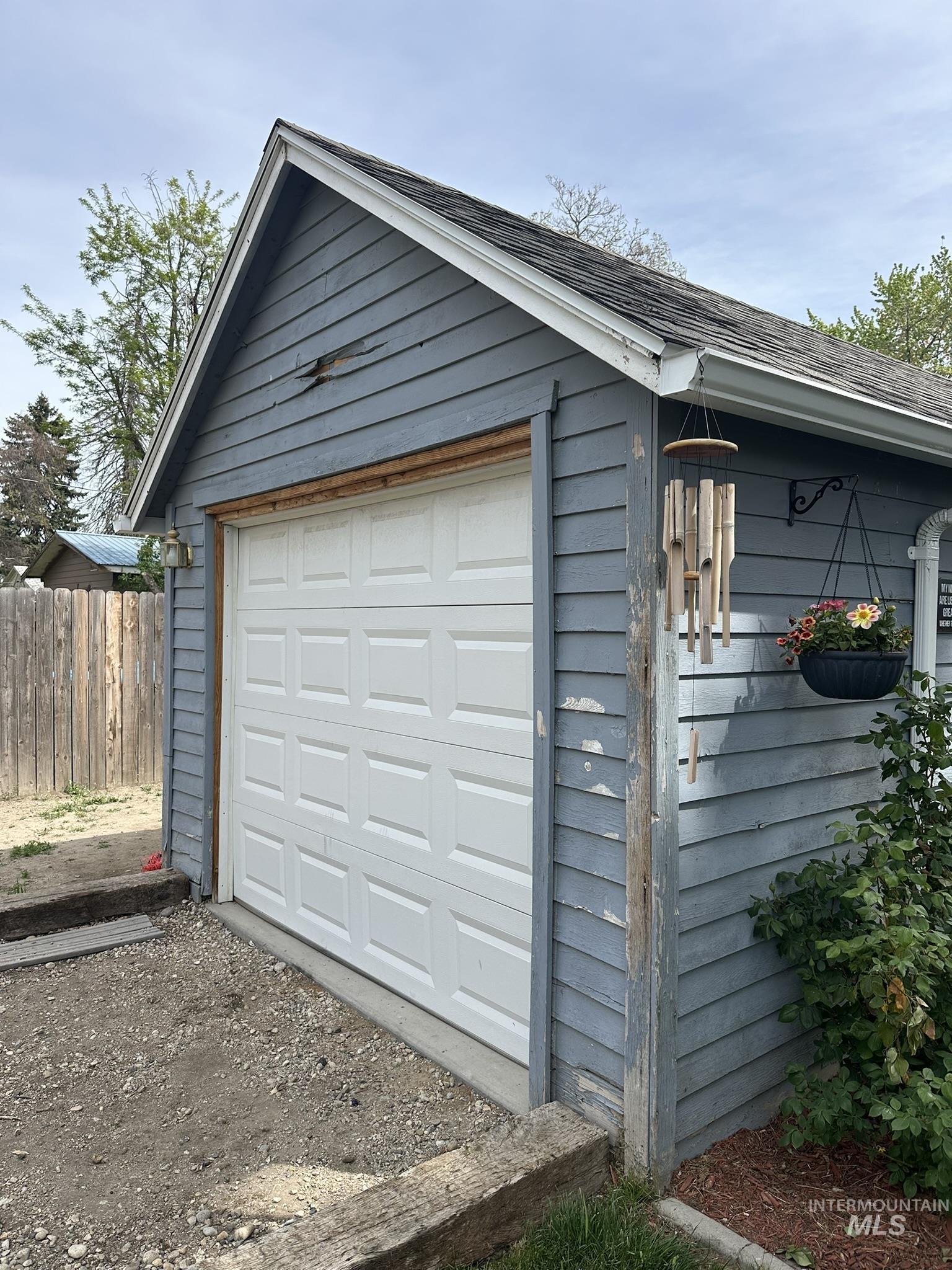 409 North 7th Street Payette, ID 83661 - Photo 18 of 23 Detached garage featuring panel siding and a white sectional garage door