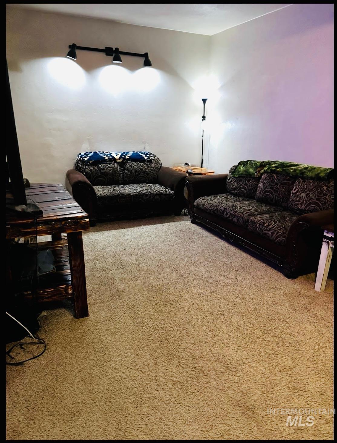 409 North 7th Street Payette, ID 83661 - Photo 5 of 23 Wall-to-wall carpeting in a neutral tone complements the light-colored walls
