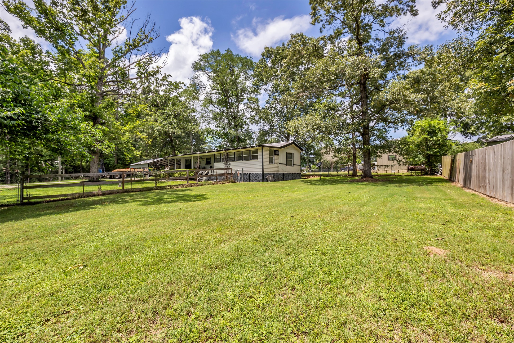 188 Chrissy Lane Trinity, TX 75862 - Photo 19 of 25 a view of a swimming pool with an outdoor space and seating area