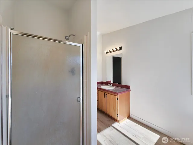a view of a bathroom with mirror gate