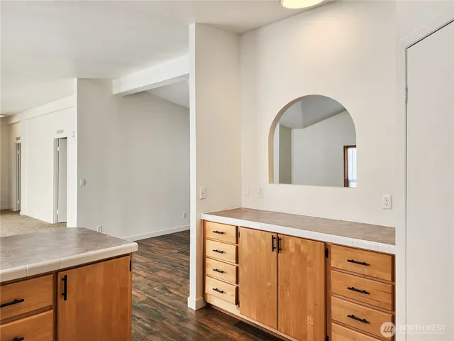 a view of an entryway with wooden floor