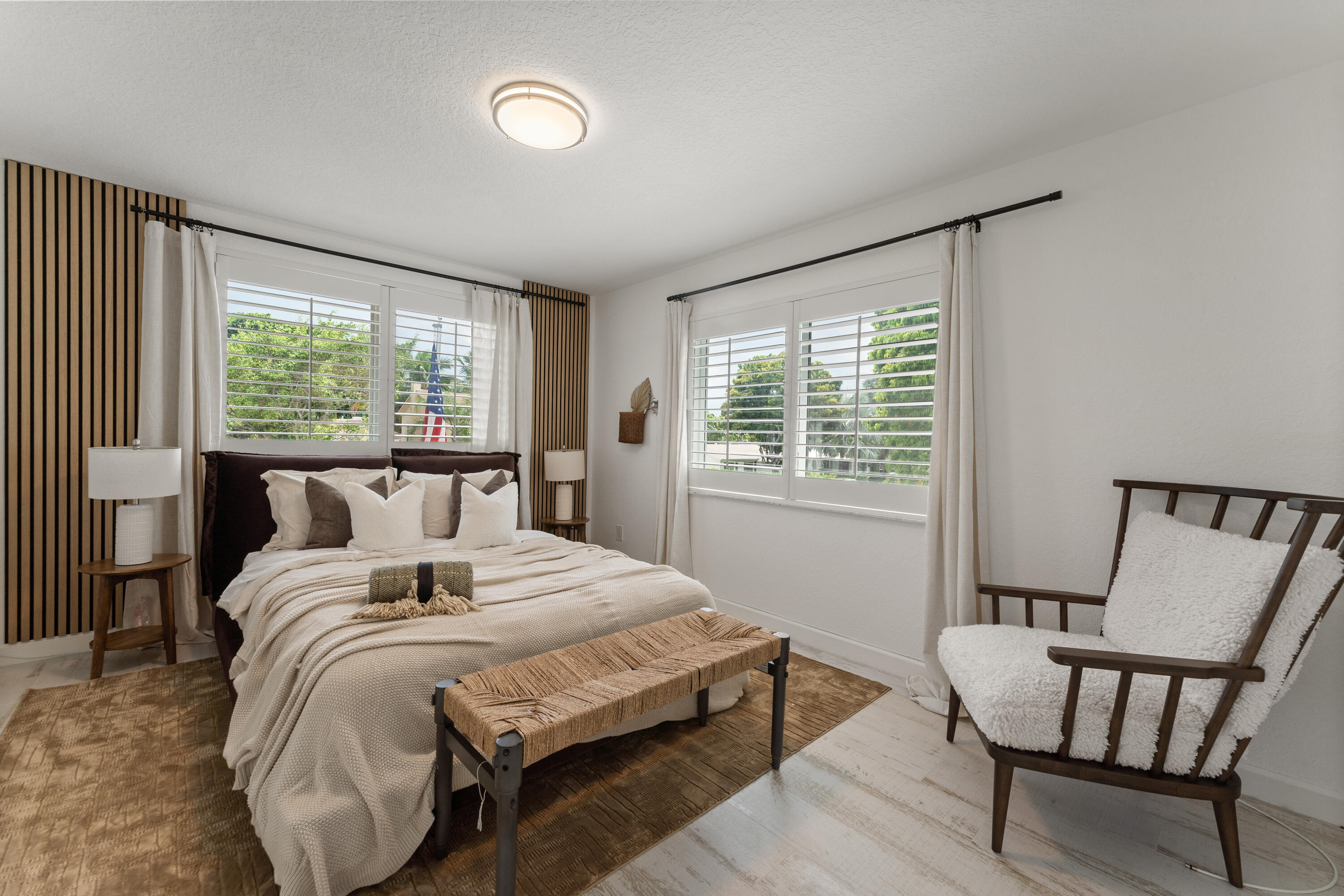 921 Ortega Road West Palm Beach, FL 33405 - Photo 17 of 60 a bedroom with a bed and wooden floor