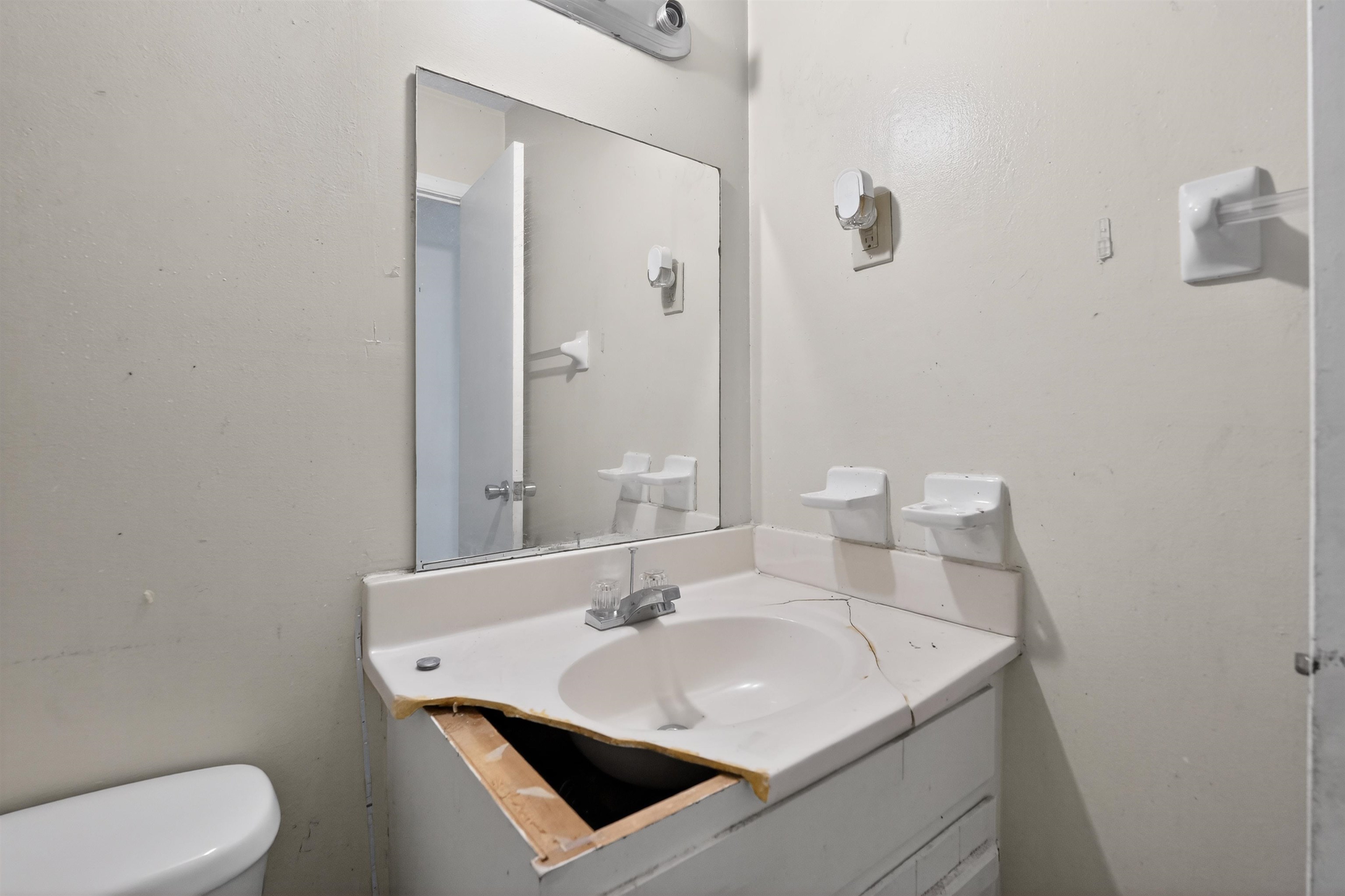3372 Spring Shadow Drive Memphis, TN 38118 - Photo 28 of 35 Bathroom vanity featuring a white countertop with an integrated sink and chrome faucet