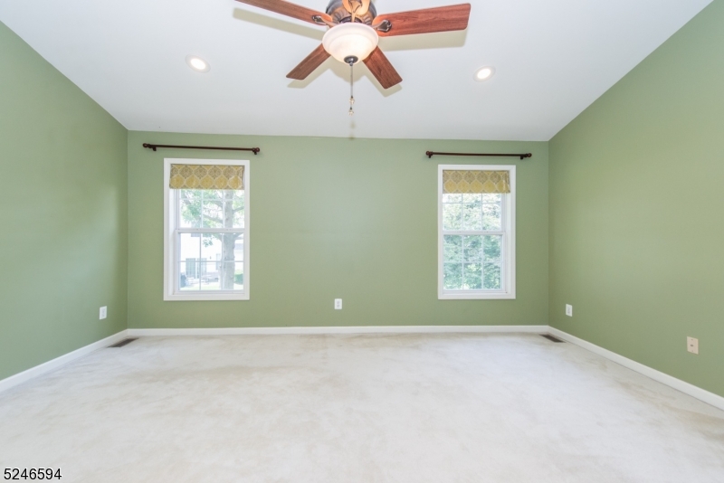 551 Coventry Drive Nutley, NJ 07110 - Photo 18 of 22 an empty room with a window and a fan