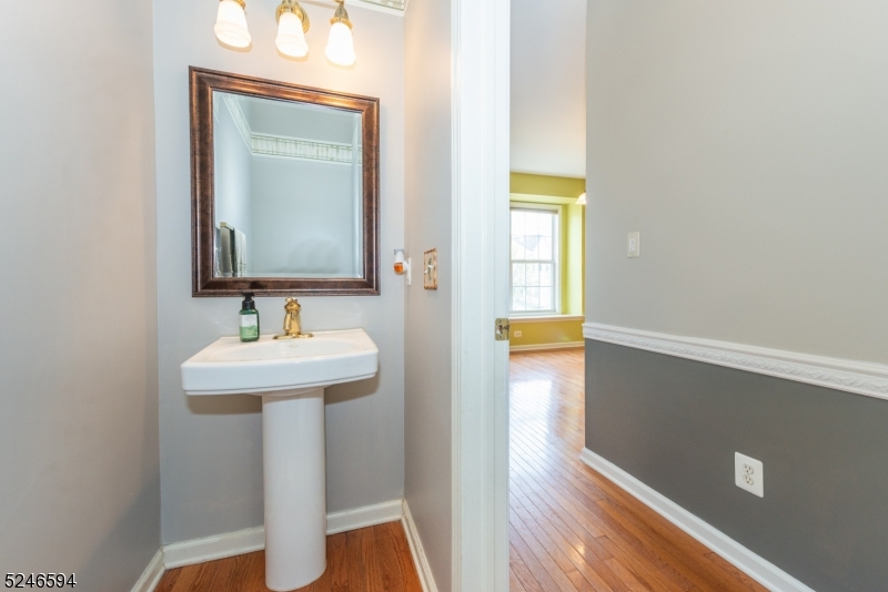 551 Coventry Drive Nutley, NJ 07110 - Photo 21 of 22 a bathroom with a sink and a mirror