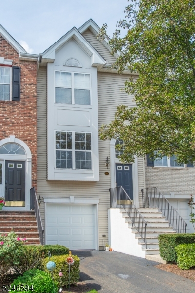 551 Coventry Drive Nutley, NJ 07110 - Photo 22 of 22 a front view of a house with a garden