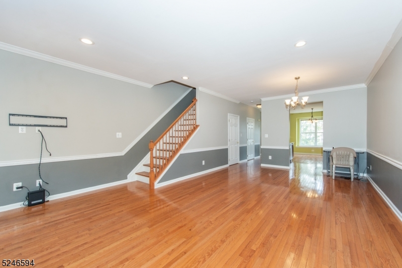 551 Coventry Drive Nutley, NJ 07110 - Photo 6 of 22 a view of empty room with wooden floor and fan
