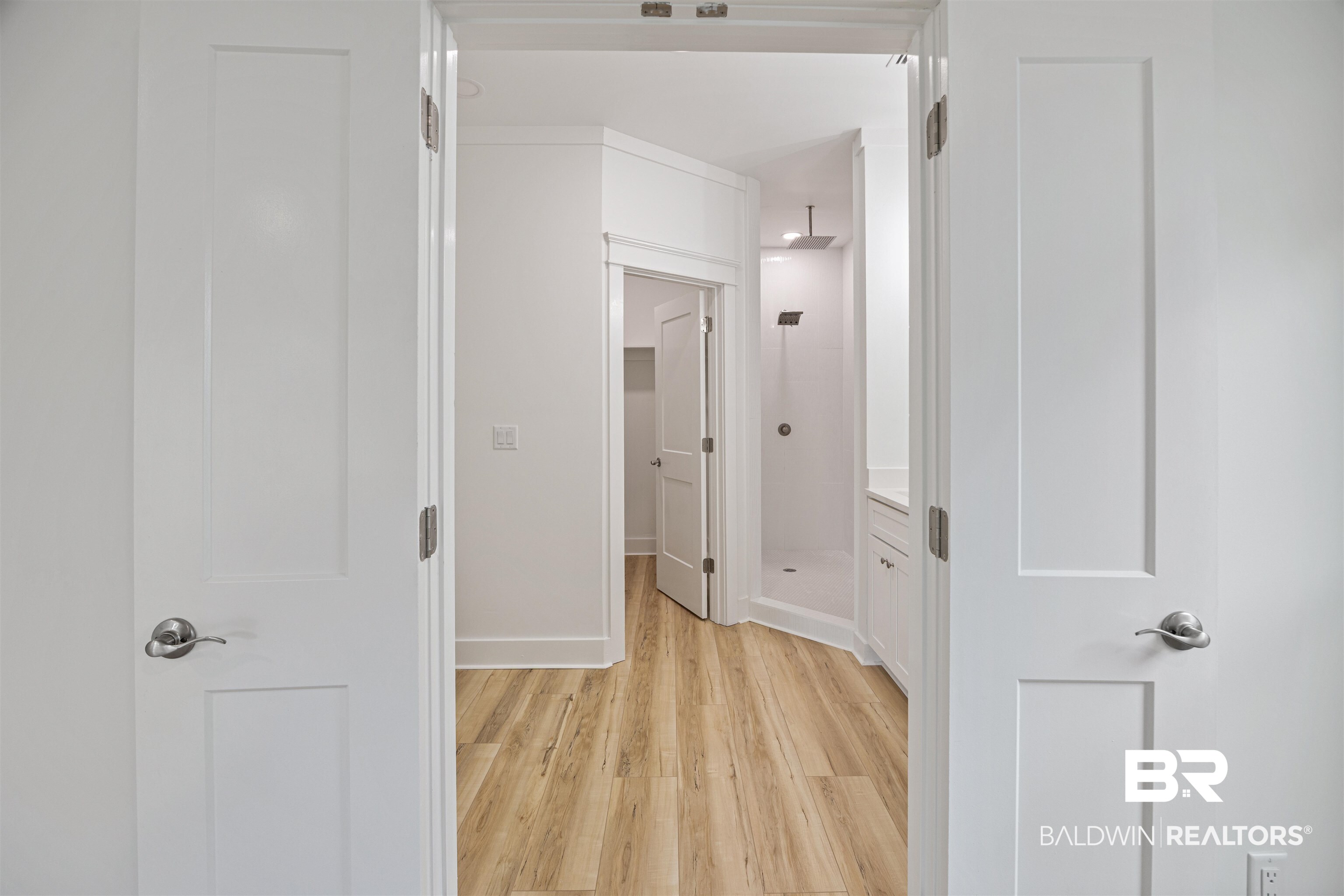 27591 Canal Road Orange Beach, AL 36561 - Photo 23 of 51 Hall with light wood-style floors and baseboards